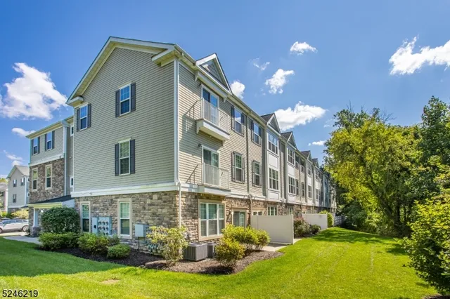 a view of a building with a yard