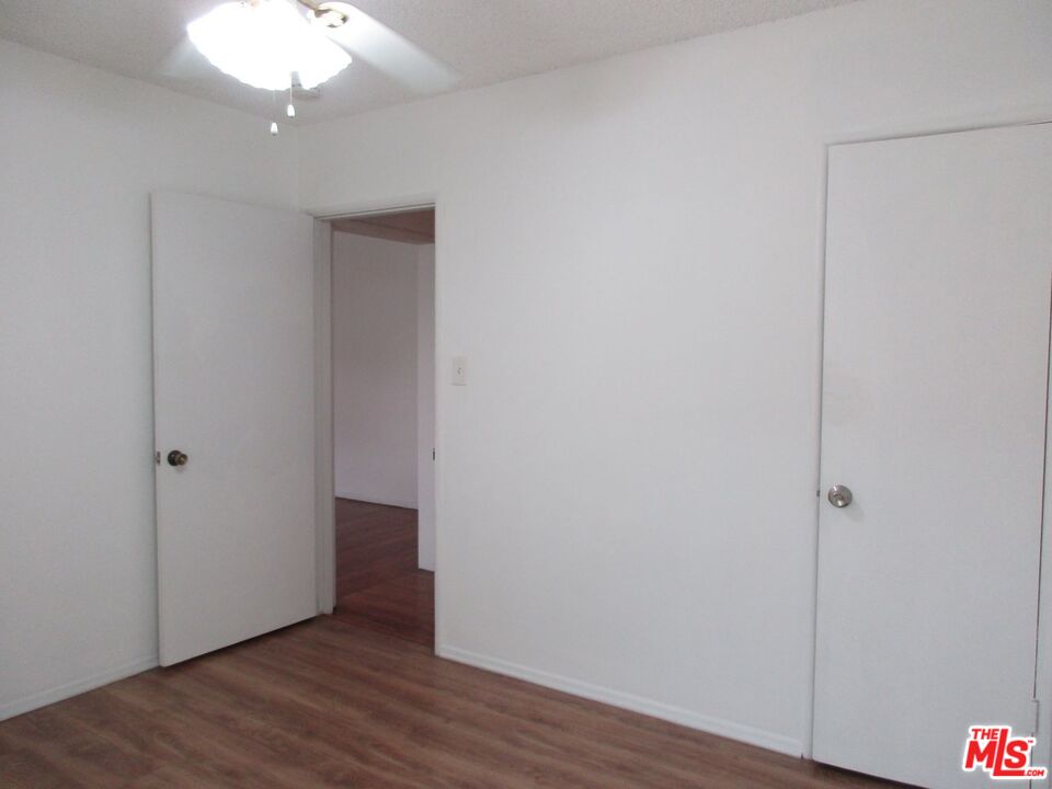 719 East 154th Street Compton, CA 90220 - Photo 19 of 32 a view of an empty room with wooden floor