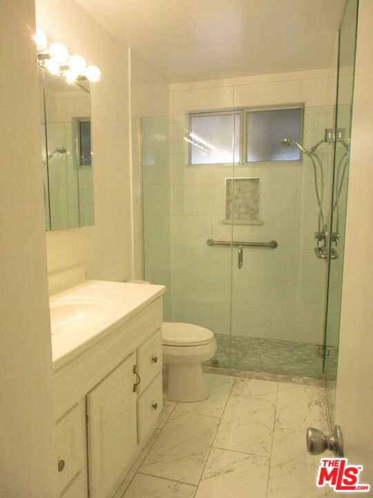 719 East 154th Street Compton, CA 90220 - Photo 20 of 32 a bathroom with a sink a toilet and shower