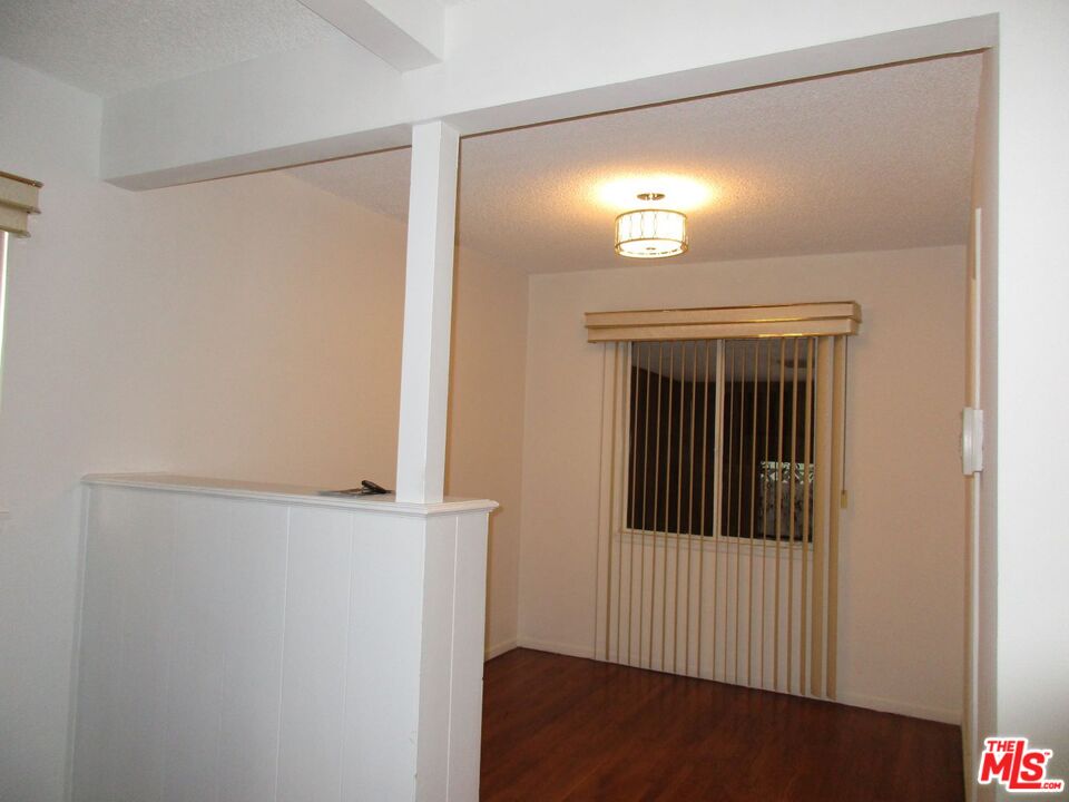 719 East 154th Street Compton, CA 90220 - Photo 7 of 32 a view of a small space with wooden floor and a window