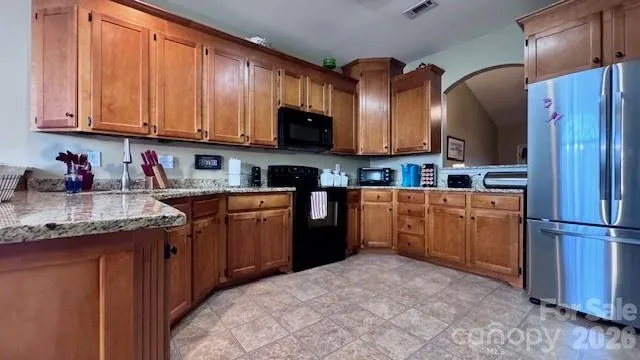 a kitchen with a sink cabinets and appliances
