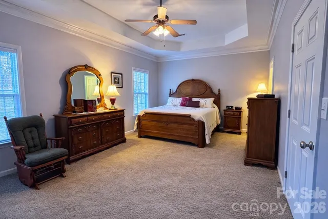 a bedroom with a bed and a gym equipment