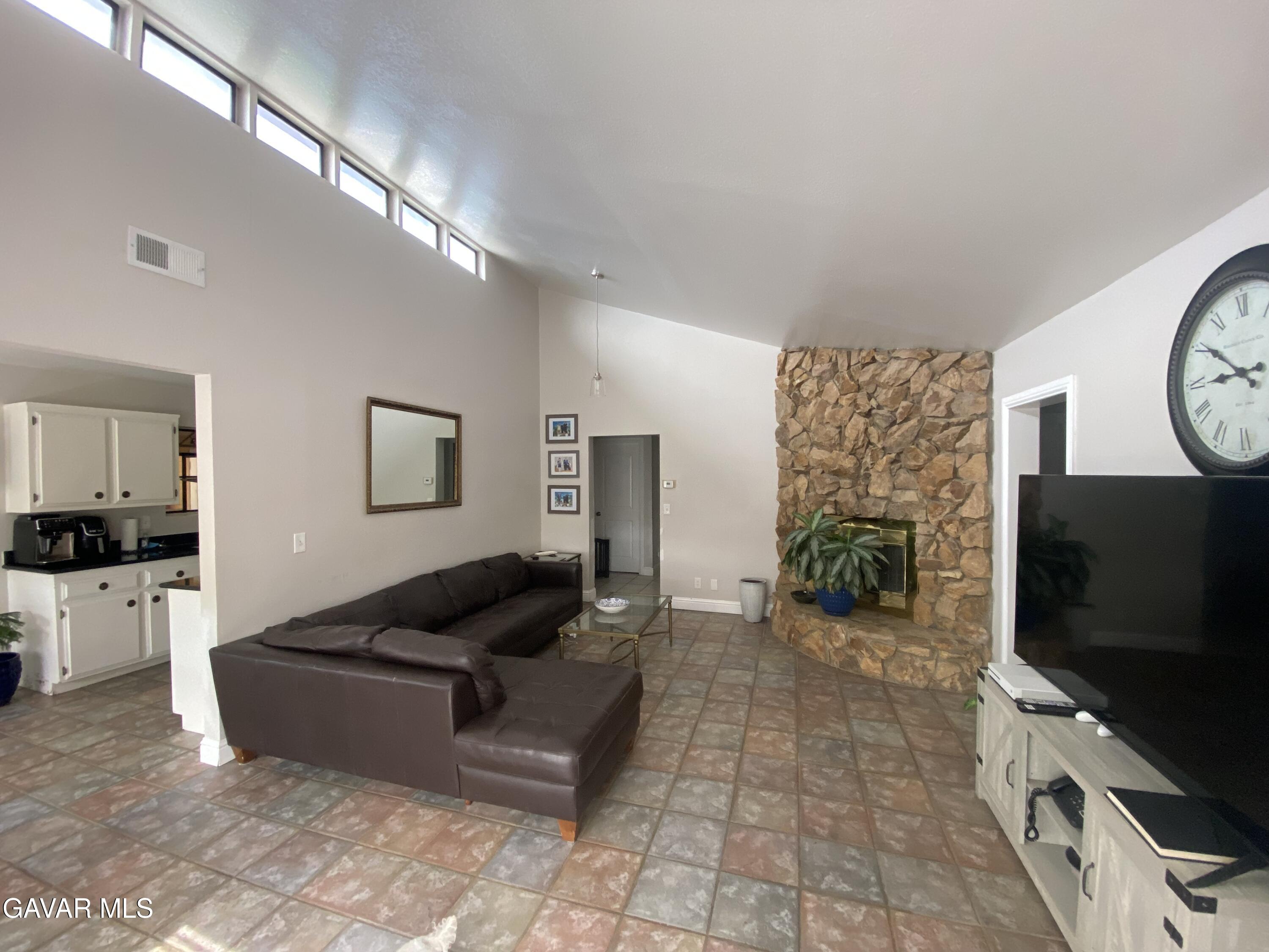 20909 Ridgeway Drive Tehachapi, CA 93561 - Photo 3 of 13 a living room with furniture and a flat screen tv