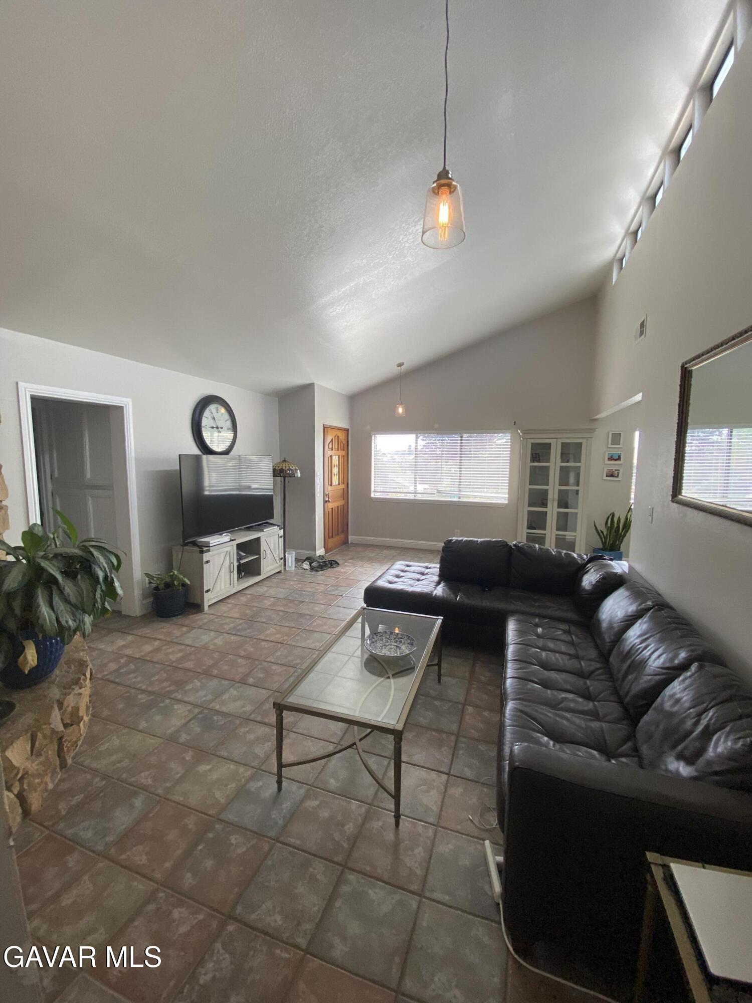 20909 Ridgeway Drive Tehachapi, CA 93561 - Photo 9 of 13 a living room with furniture and a fireplace