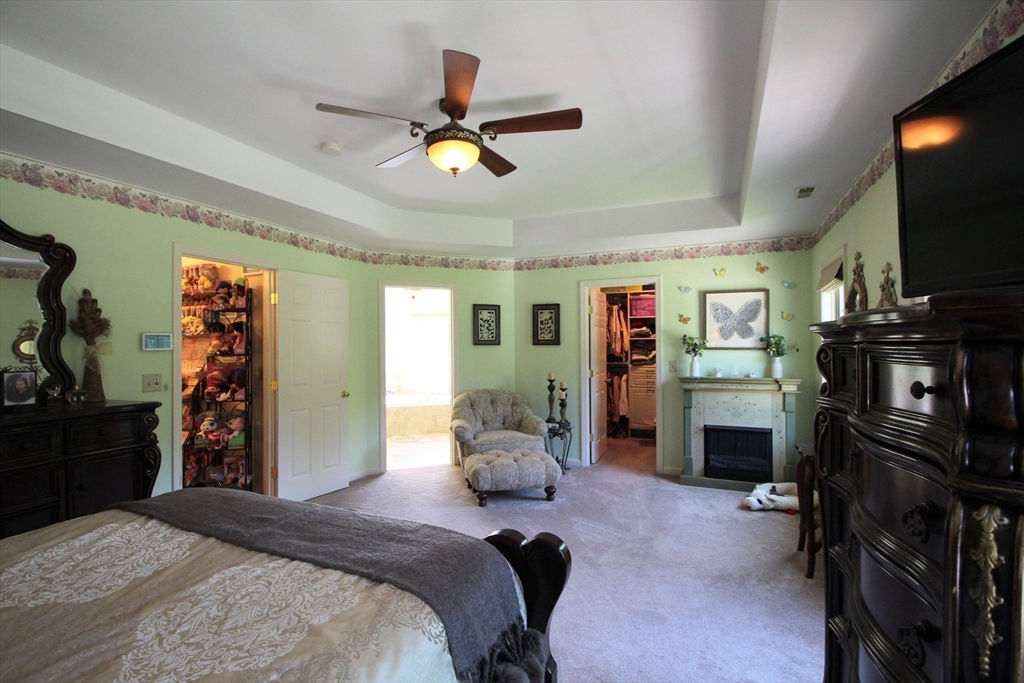 5 Gableview Lane Southwick, MA 01077 - Photo 27 of 41 a bedroom with a bed and a flat screen tv