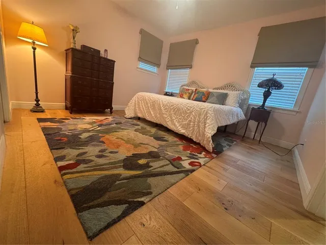 a bedroom with a bed and a dresser