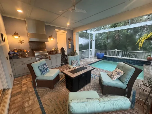 a living room with furniture and a floor to ceiling window