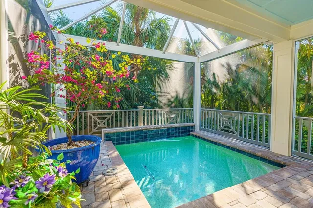 a view of a balcony with flower plants