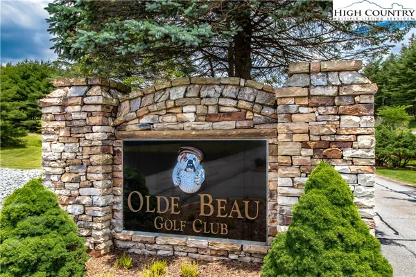 a sign that is on a brick wall