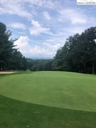 a view of a golf course with a swimming pool