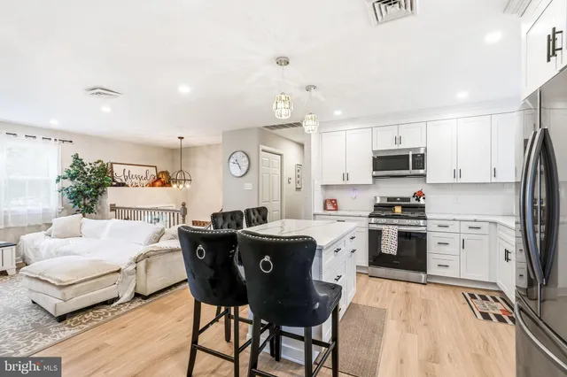 a bedroom with furniture and a flat screen tv