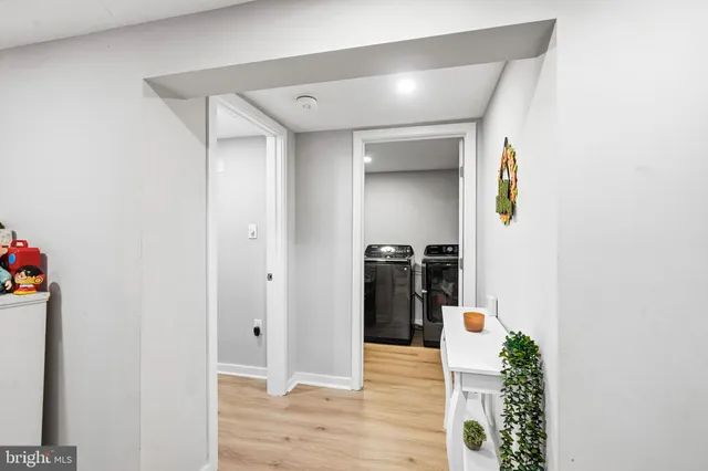 a playing room with furniture and a flat screen tv