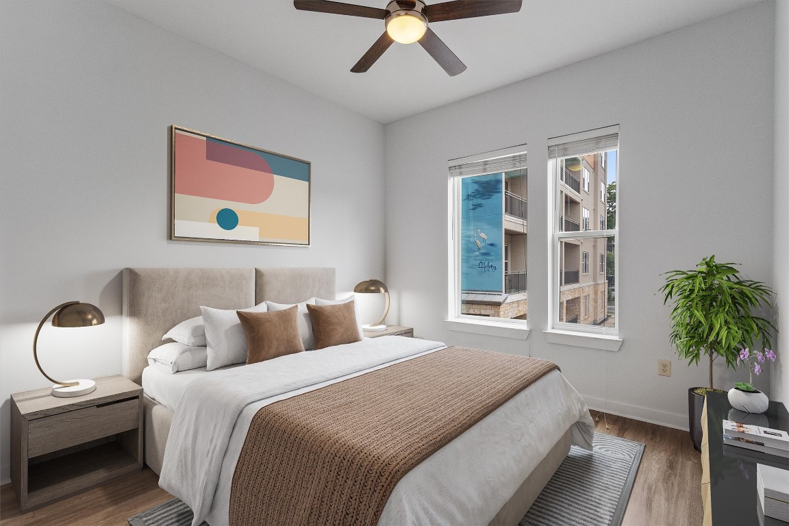 1900 Barton Springs Road, Unit 2027 Austin, TX 78704 - Photo 12 of 28 Bedroom with wood finished floors and ceiling fan