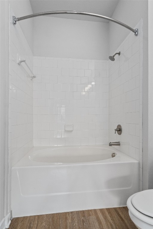 1900 Barton Springs Road, Unit 2027 Austin, TX 78704 - Photo 16 of 28 Bathroom with washtub / shower combination and wood finished floors
