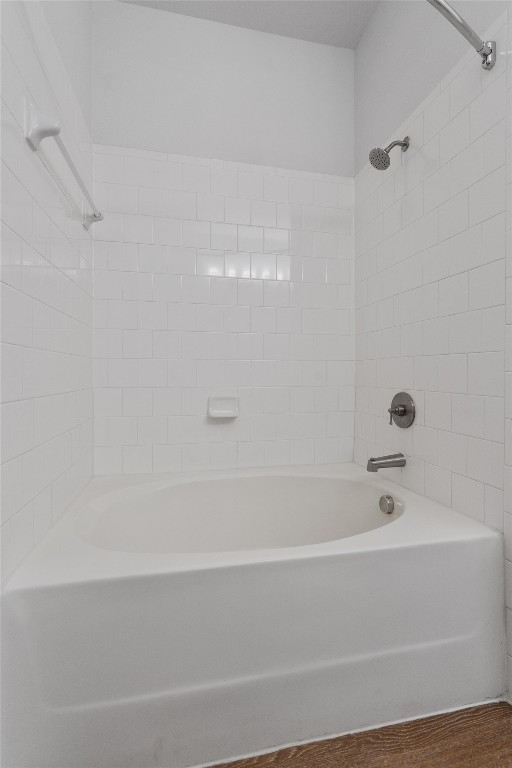 1900 Barton Springs Road, Unit 2027 Austin, TX 78704 - Photo 21 of 28 Bathroom featuring shower / bath combination and wood finished floors