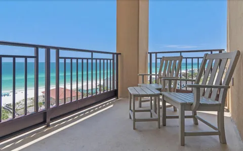 a view of a balcony with furniture
