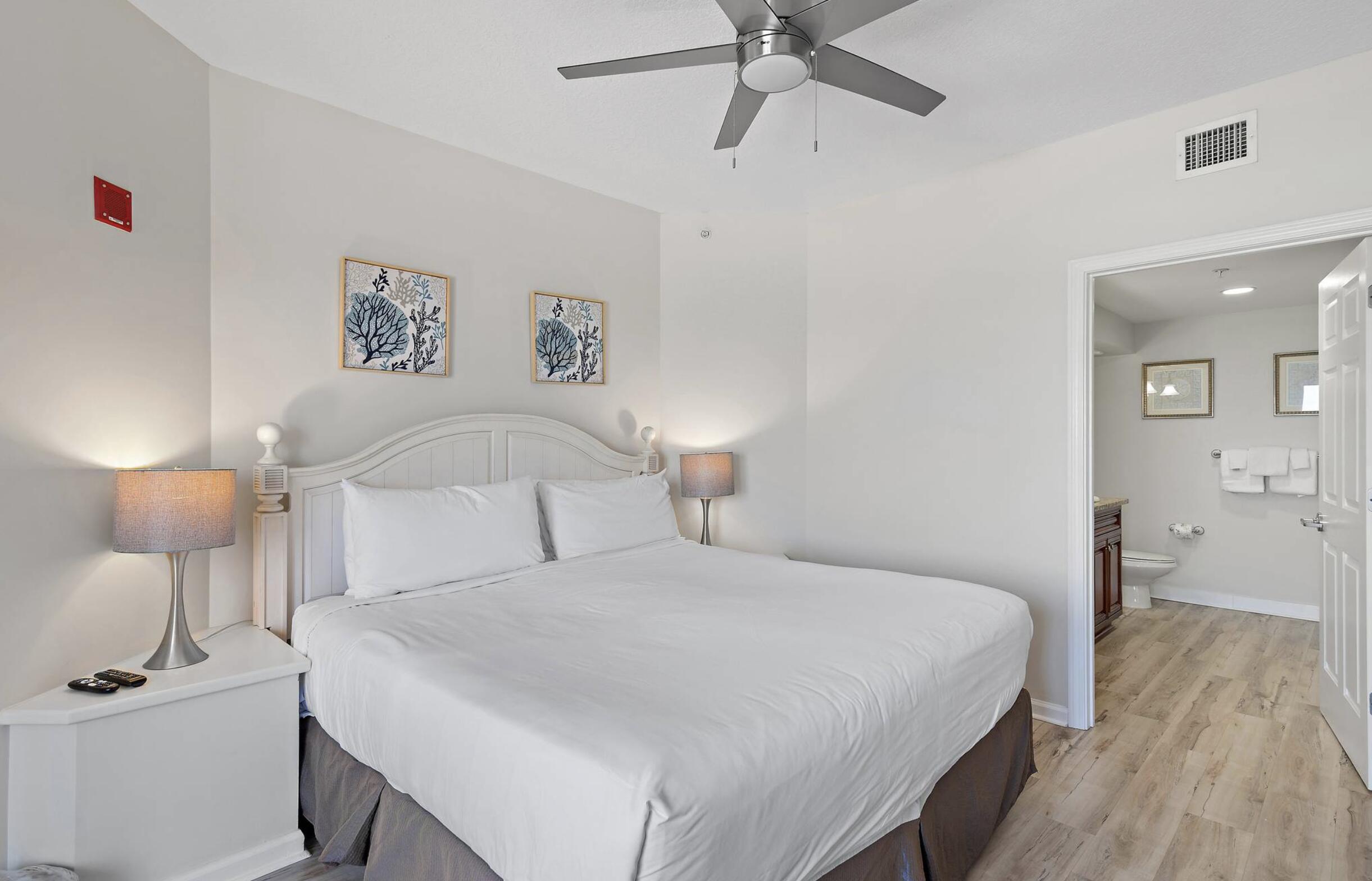 4789 Westwinds Drive, Unit 4789 Miramar Beach, FL 32550 - Photo 13 of 32 a bedroom with a bed and painting on the wall