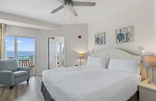 a bedroom with a large bed and a couch