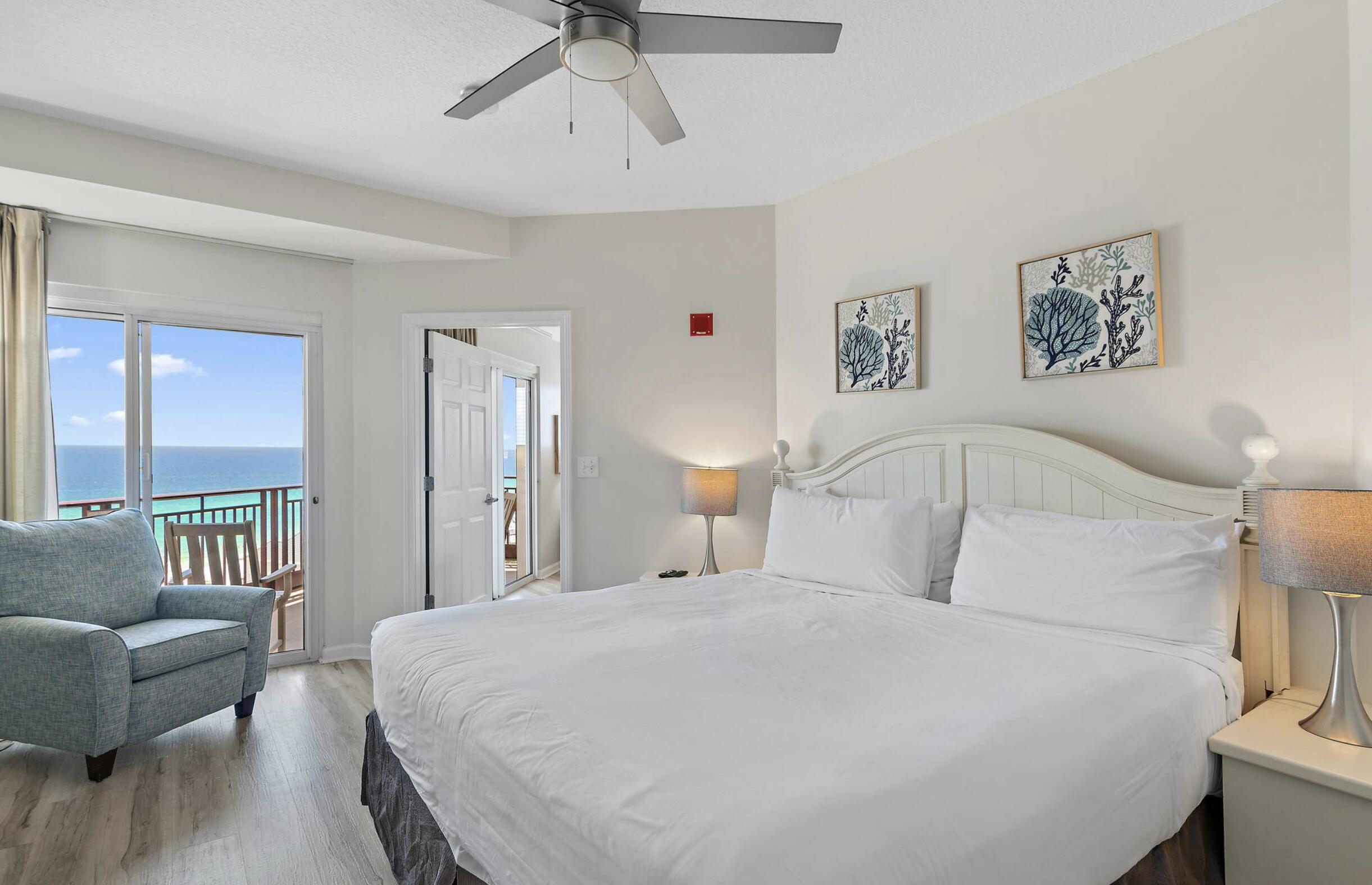 4789 Westwinds Drive, Unit 4789 Miramar Beach, FL 32550 - Photo 14 of 32 a bedroom with a large bed and a couch