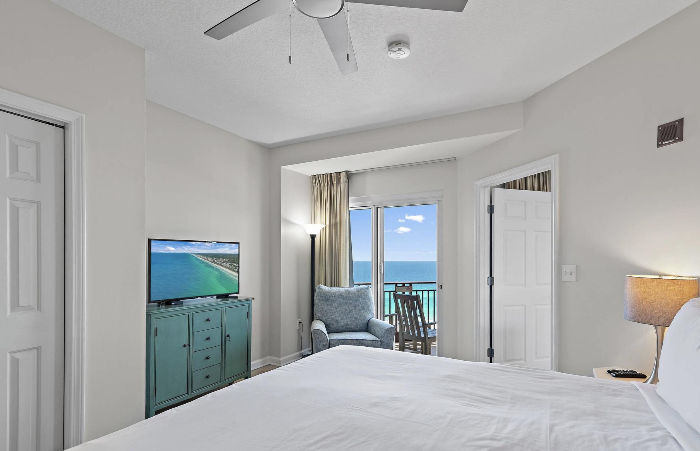 4789 Westwinds Drive, Unit 4789 Miramar Beach, FL 32550 - Photo 15 of 32 a bedroom with a bed and a mirror on dresser