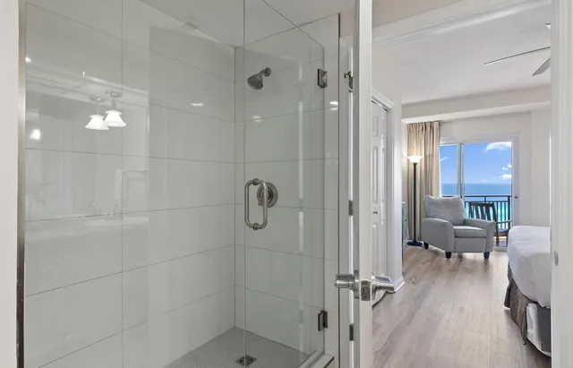 a bathroom with a glass shower door