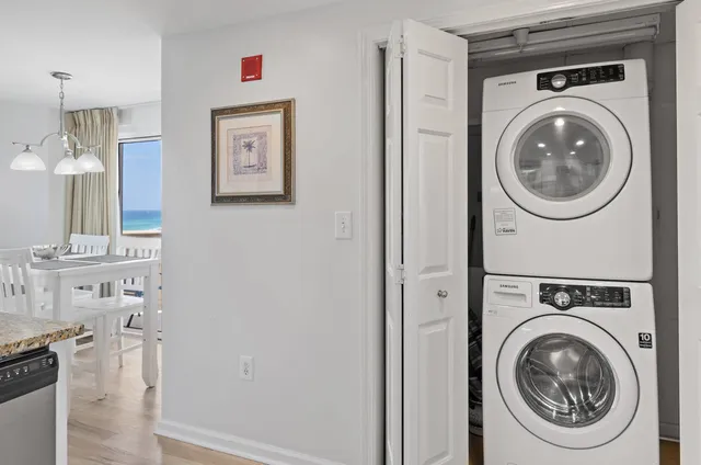 a view of a hallway with washer and dryer