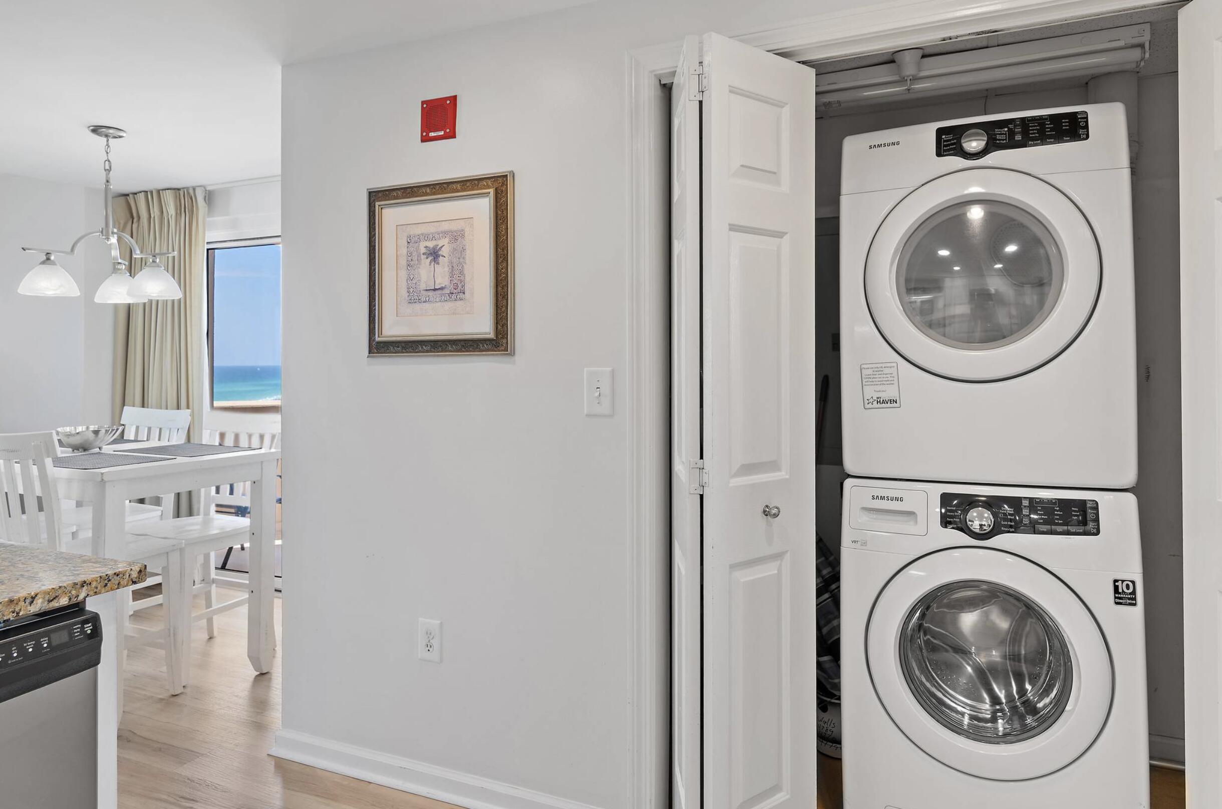4789 Westwinds Drive, Unit 4789 Miramar Beach, FL 32550 - Photo 19 of 32 a view of a hallway with washer and dryer