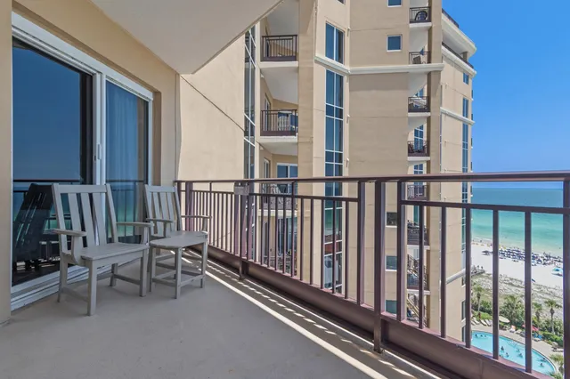a view of a balcony with chairs