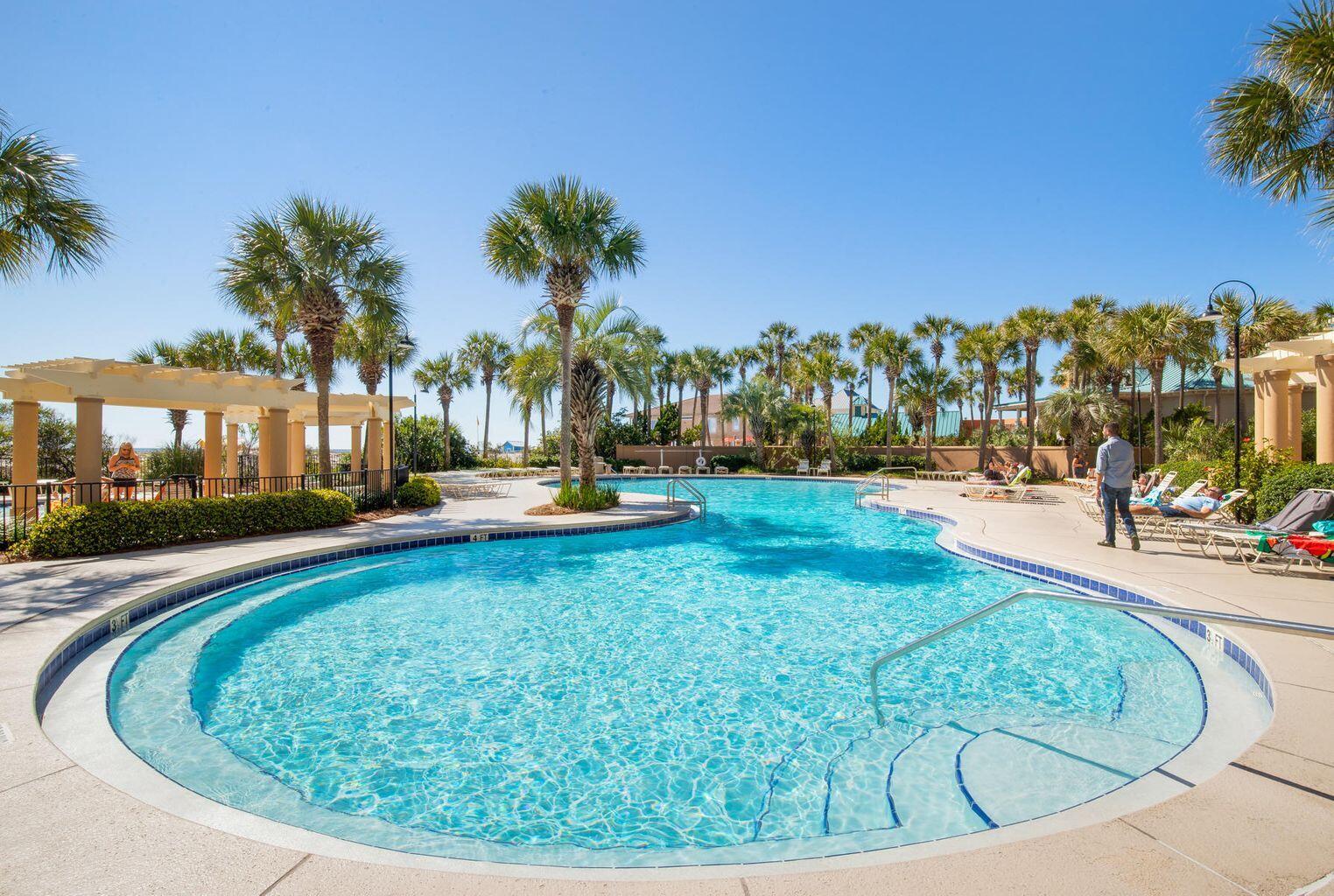 4789 Westwinds Drive, Unit 4789 Miramar Beach, FL 32550 - Photo 28 of 32 a view of a swimming pool with outdoor seating