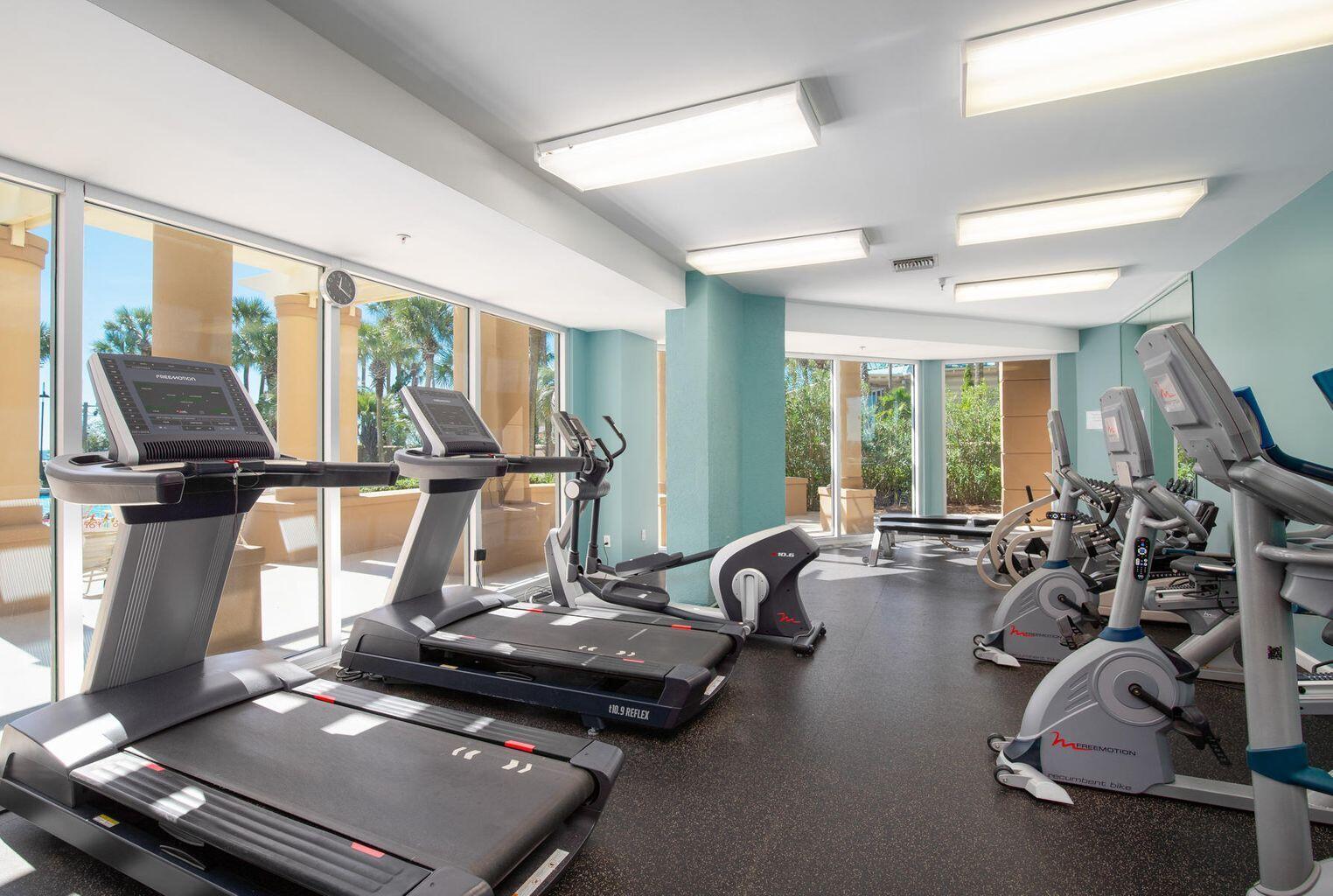 4789 Westwinds Drive, Unit 4789 Miramar Beach, FL 32550 - Photo 31 of 32 a room with gym equipment and a large window