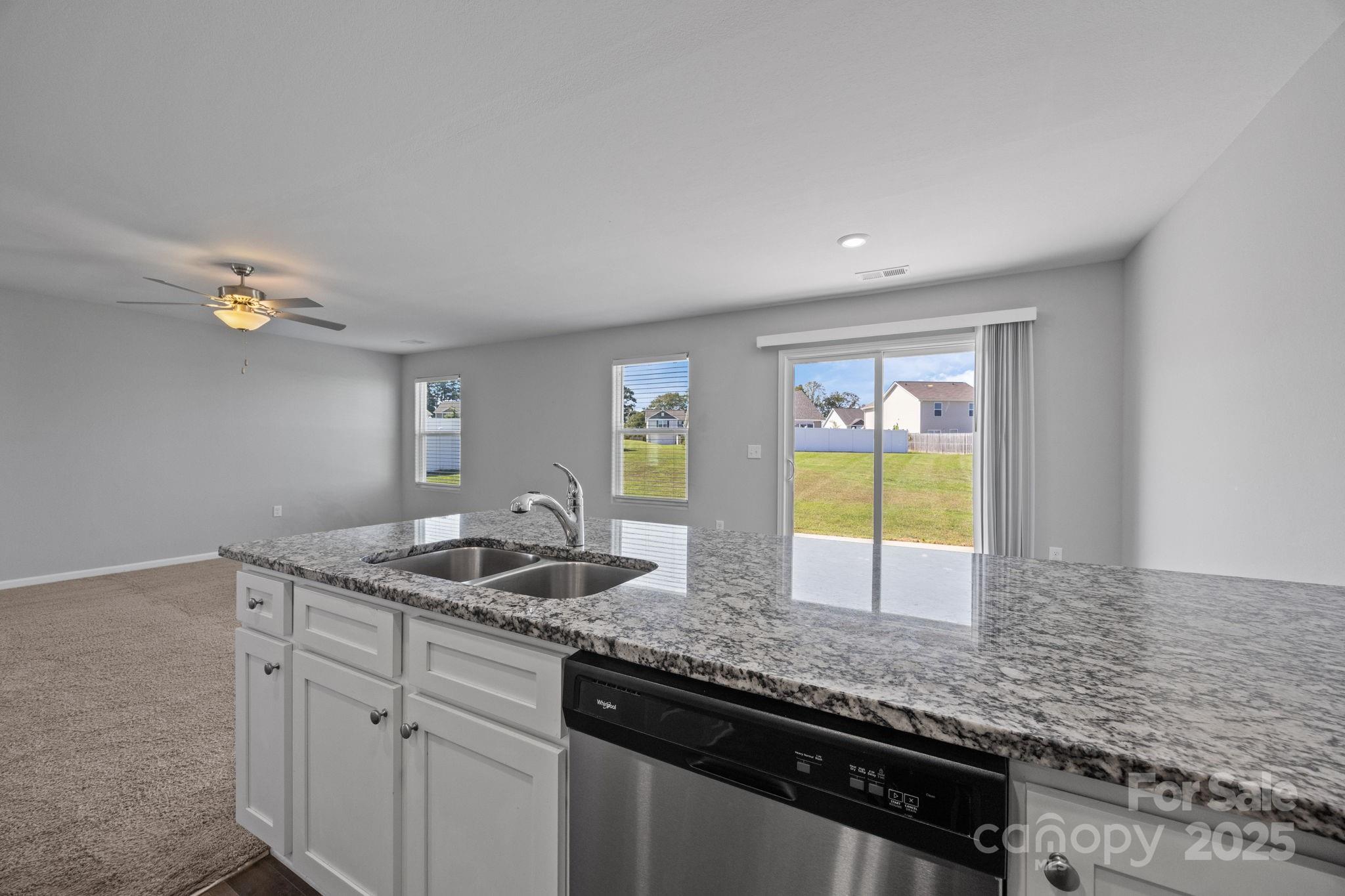 163 Kipling Lane Kings Mountain, NC 28086 - Photo 11 of 46 a kitchen with granite countertop kitchen island a sink and a window