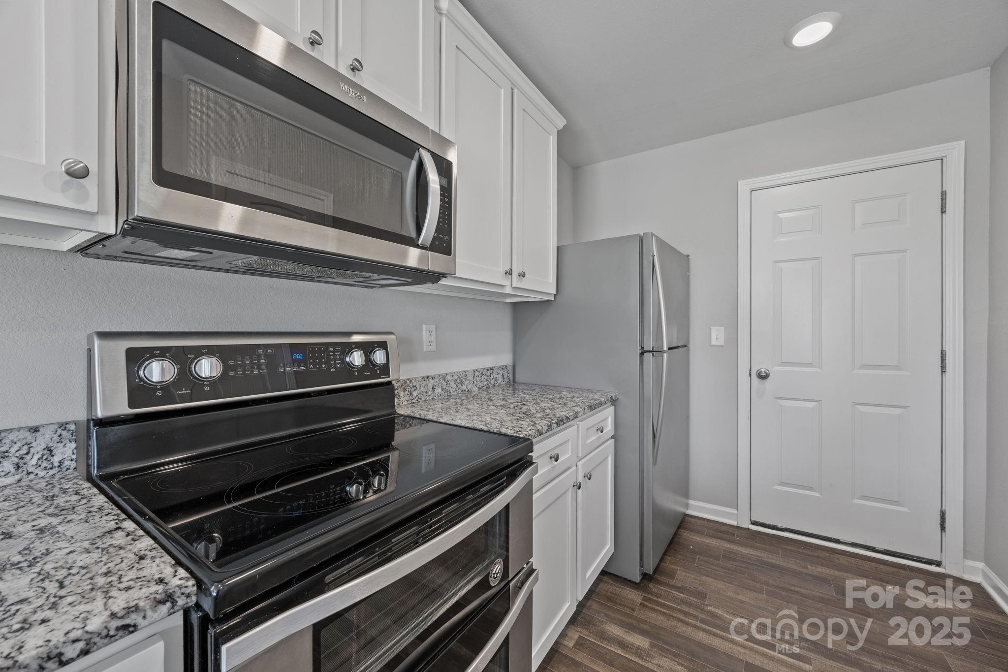 163 Kipling Lane Kings Mountain, NC 28086 - Photo 8 of 46 a kitchen with a stove microwave and refrigerator
