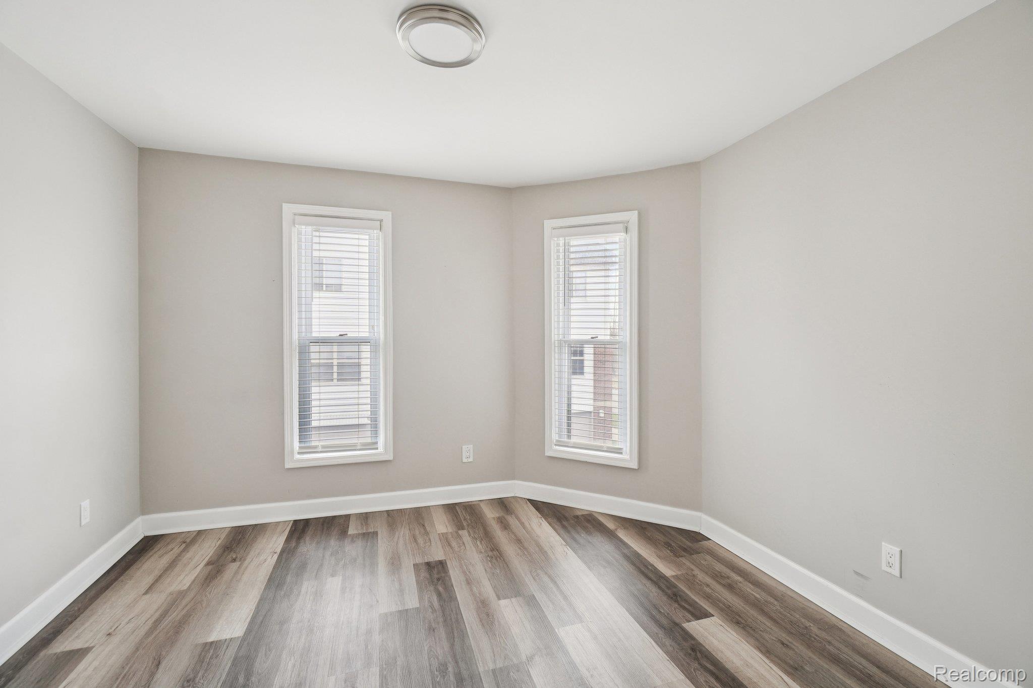 3822 Wabash Street Detroit, MI 48208 - Photo 14 of 17 Unfurnished room with light wood-type flooring and baseboards