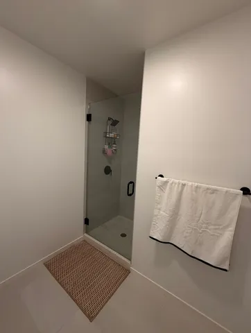a bathroom with a bathtub and shower