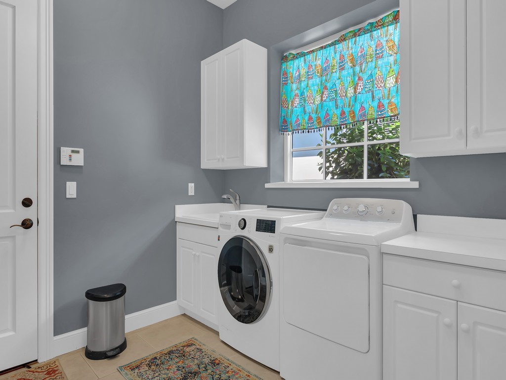 9220 Spring Time Drive Vero Beach, FL 32963 - Photo 19 of 28 a utility room with dryer and washer