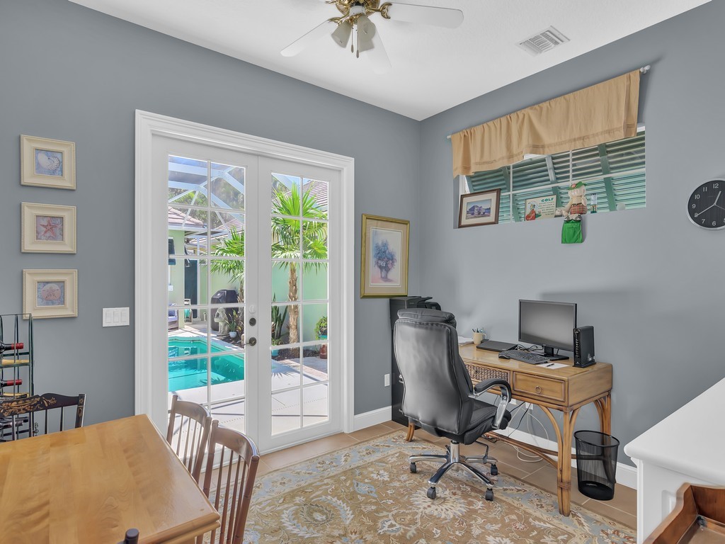 9220 Spring Time Drive Vero Beach, FL 32963 - Photo 21 of 28 a workspace with furniture and a window