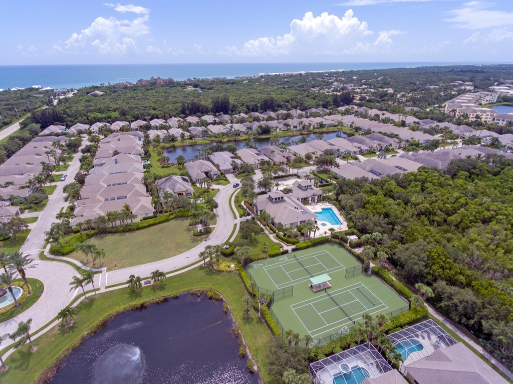 9220 Spring Time Drive Vero Beach, FL 32963 - Photo 27 of 28 an aerial view of a houses with a swimming pool