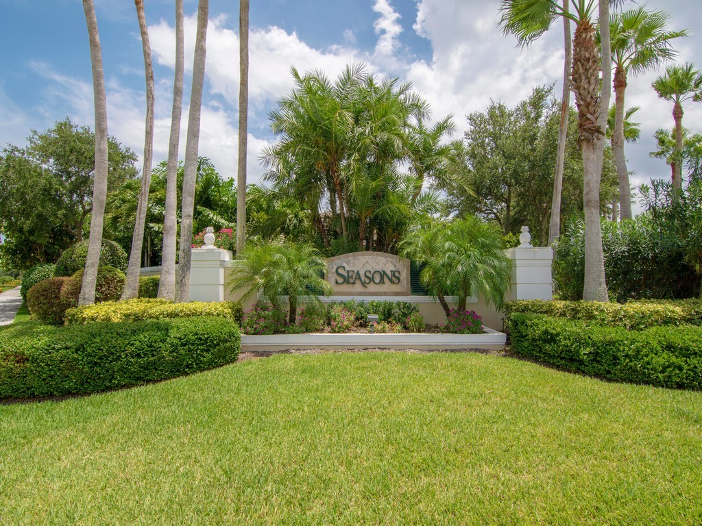 9220 Spring Time Drive Vero Beach, FL 32963 - Photo 28 of 28 a view of a back yard with plants and large trees