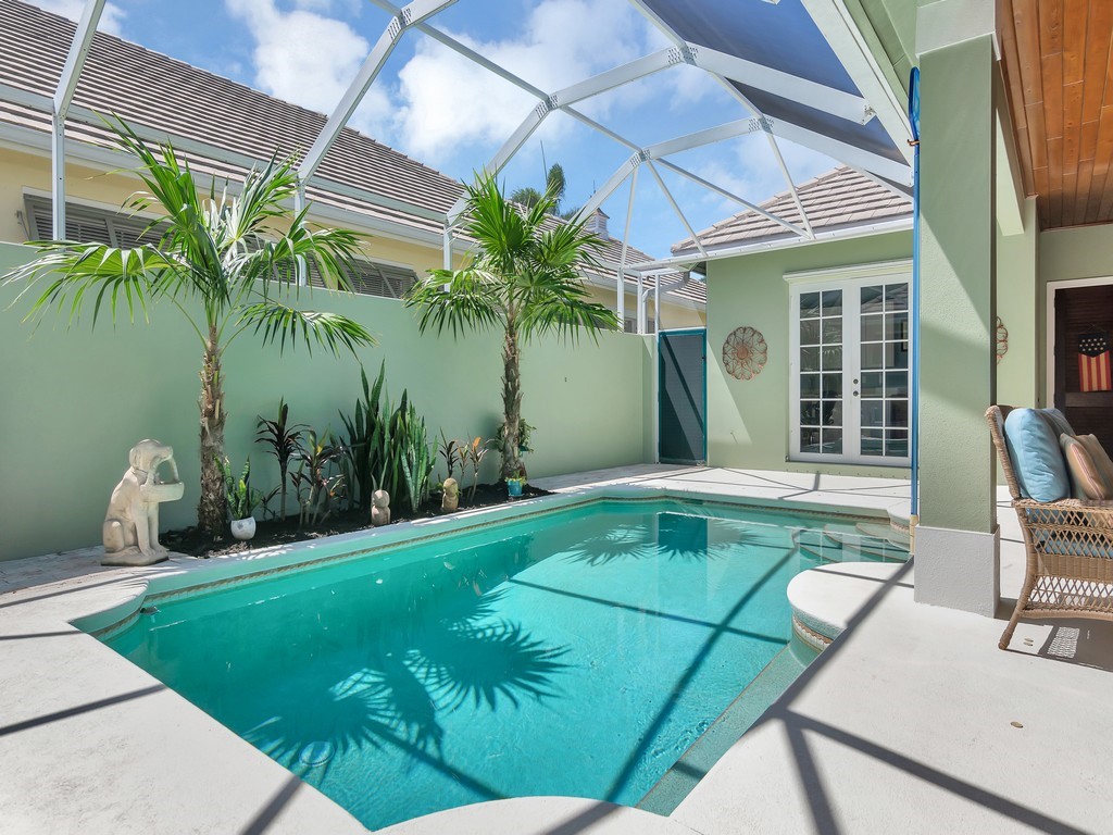 9220 Spring Time Drive Vero Beach, FL 32963 - Photo 3 of 28 a swimming pool with outdoor seating and yard