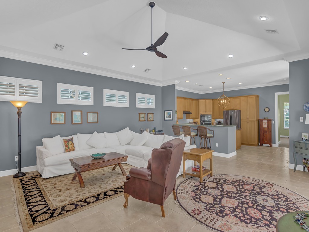 9220 Spring Time Drive Vero Beach, FL 32963 - Photo 4 of 28 a living room with furniture and a rug
