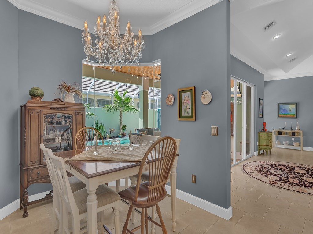 9220 Spring Time Drive Vero Beach, FL 32963 - Photo 7 of 28 a view of a dining room with furniture window and outside view