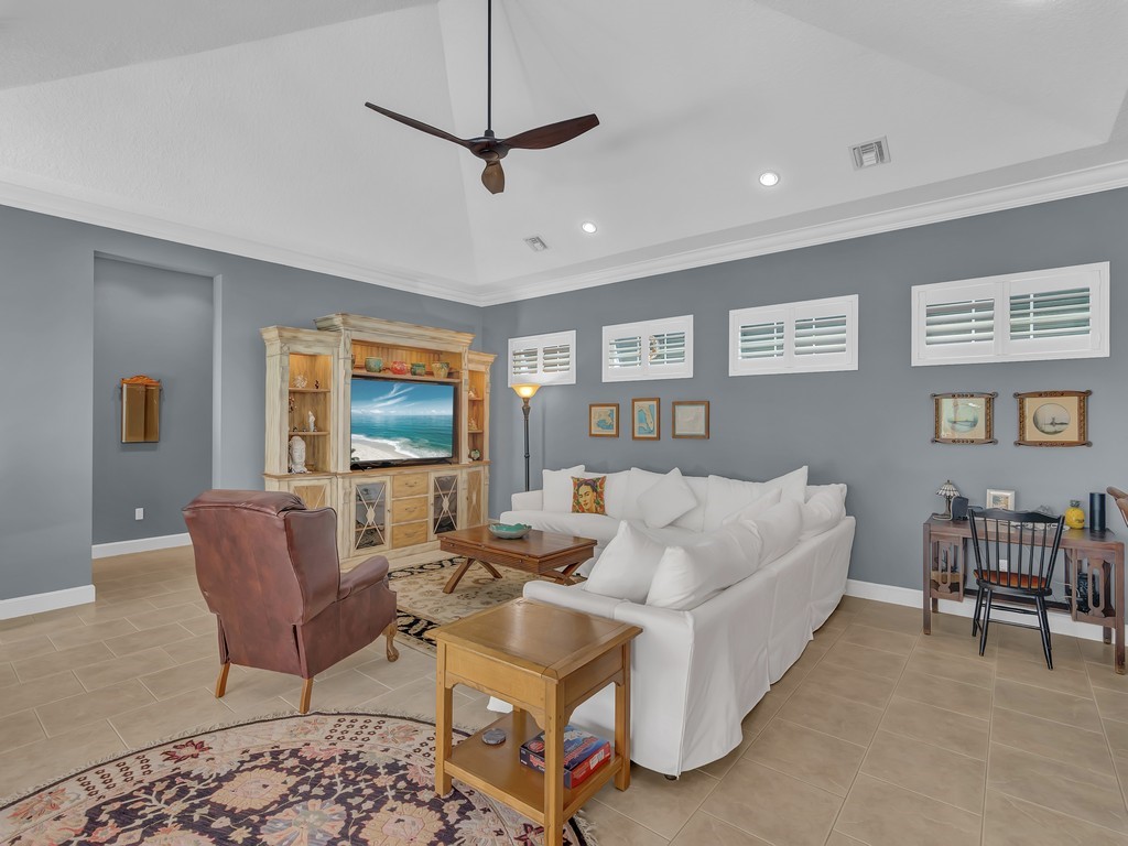 9220 Spring Time Drive Vero Beach, FL 32963 - Photo 8 of 28 a living room with furniture and a flat screen tv