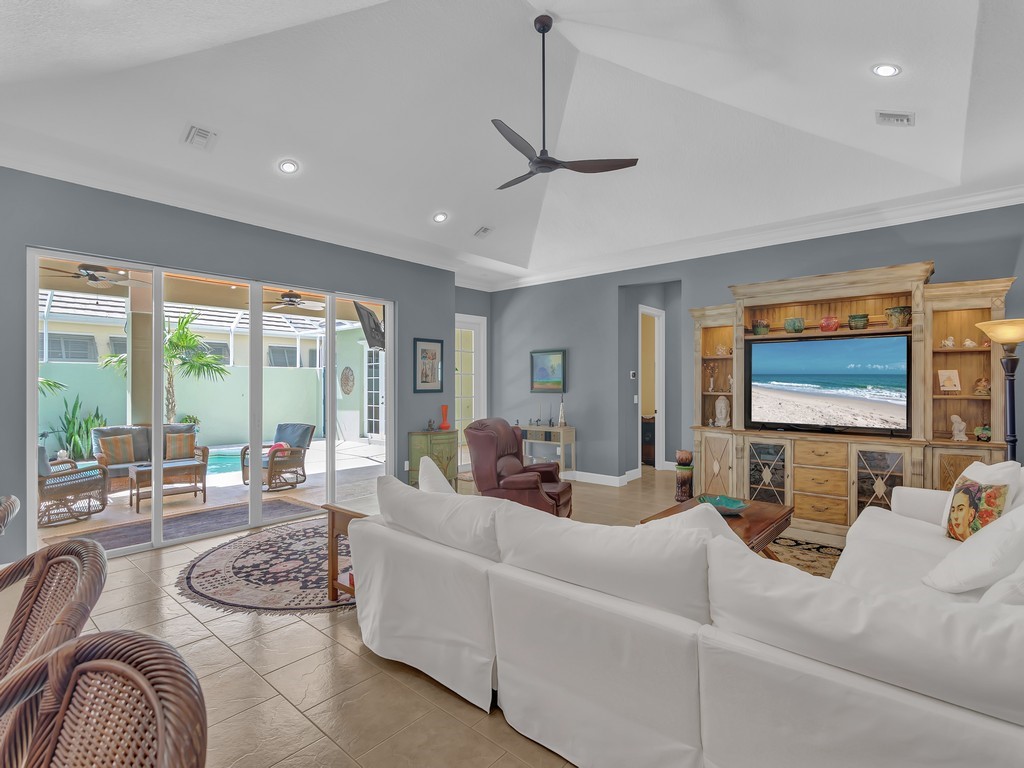 9220 Spring Time Drive Vero Beach, FL 32963 - Photo 9 of 28 a living room with furniture and a flat screen tv