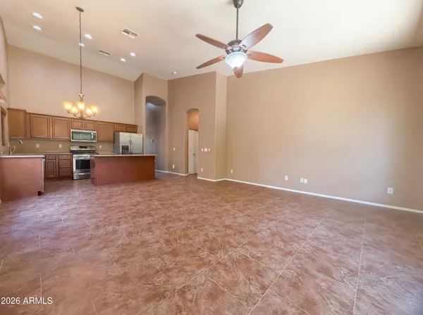 an open kitchen with window and stainless steel appliances