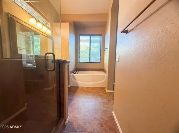 a bathroom with a granite countertop sink a toilet and shower