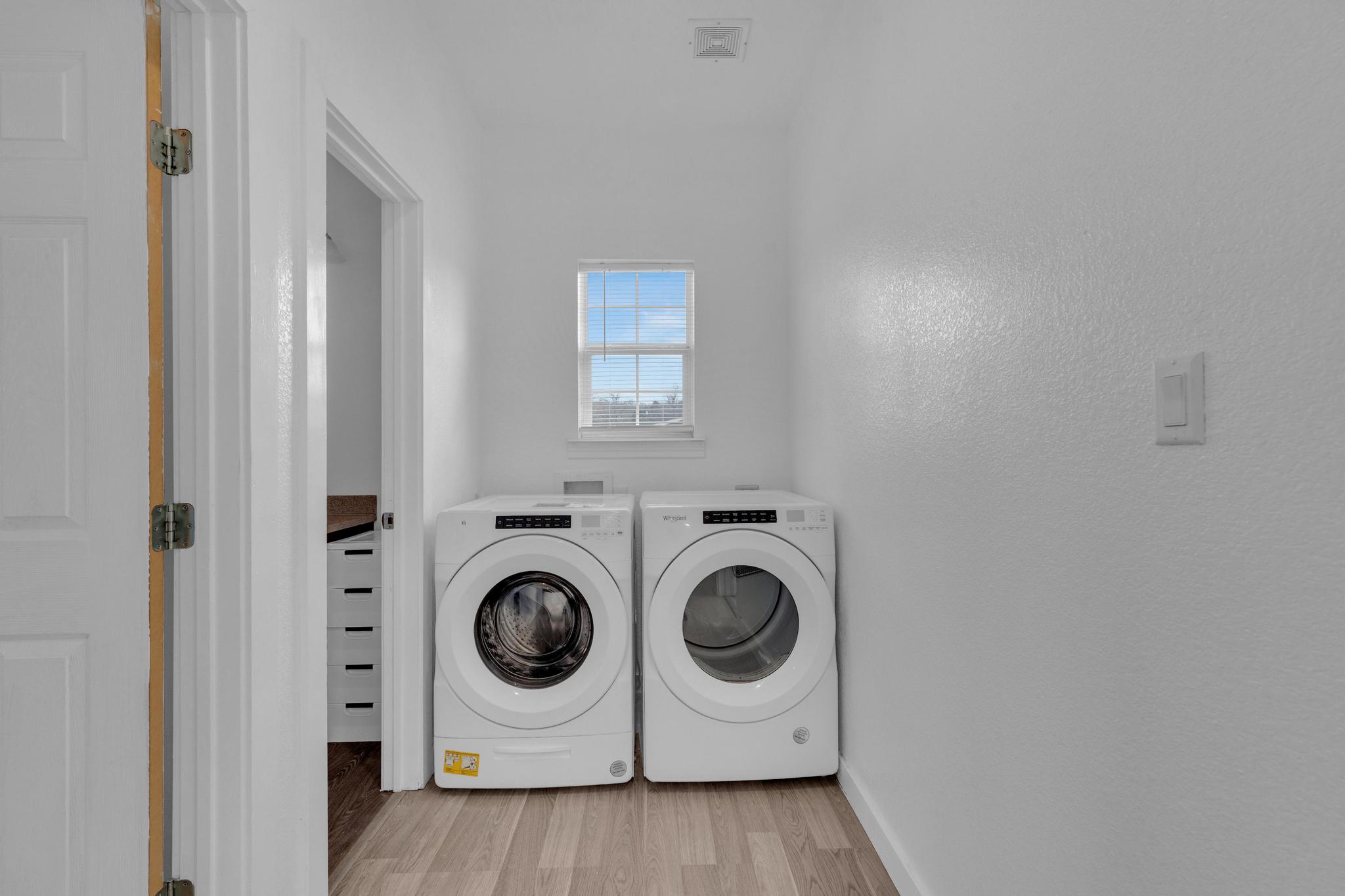 114 Crepe Myrtle Parkway Elgin, TX 78621 - Photo 9 of 40 Unit A - Washroom with light wood finished floors and independent washer and dryer