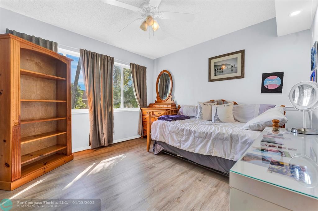 5751 Pine Terrace Plantation, FL 33317 - Photo 24 of 35 a bedroom with a bed and a window