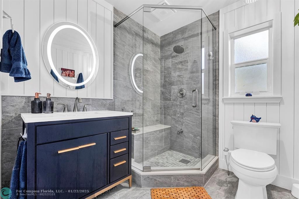 5751 Pine Terrace Plantation, FL 33317 - Photo 28 of 35 a bathroom with a sink a toilet and a mirror