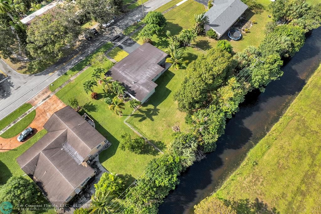 5751 Pine Terrace Plantation, FL 33317 - Photo 3 of 35 an aerial view of a house with a yard and garden