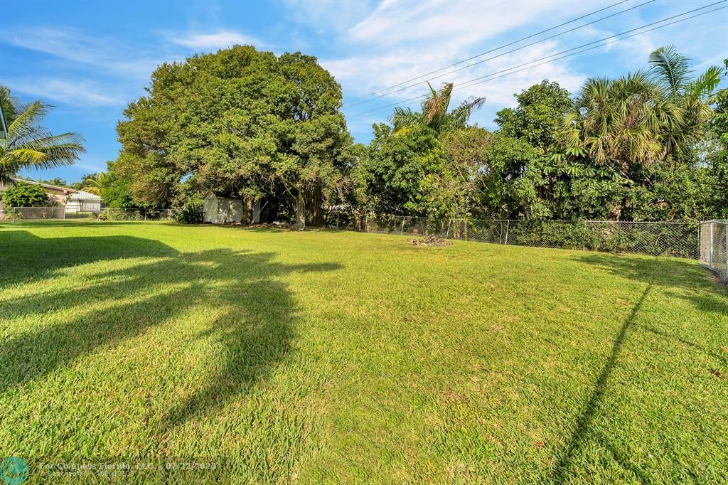 5751 Pine Terrace Plantation, FL 33317 - Photo 32 of 35 a view of yard with swimming pool and green space